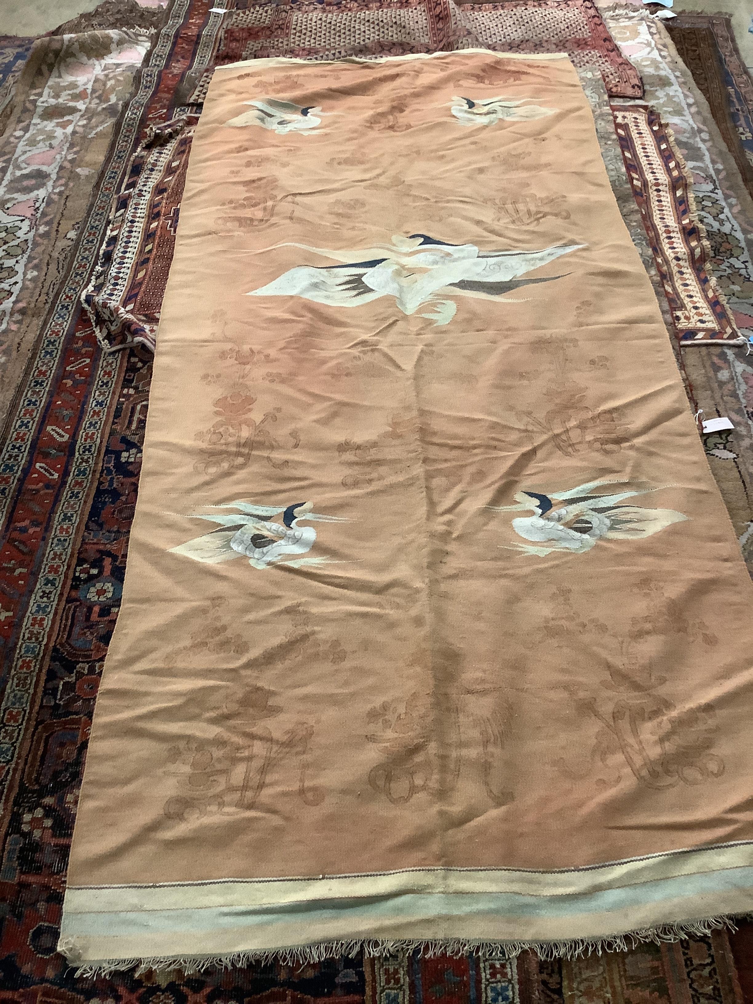 A Japanese flat weave wallhanging depicting cranes in flight and vases of flowers, 270 x 119cm